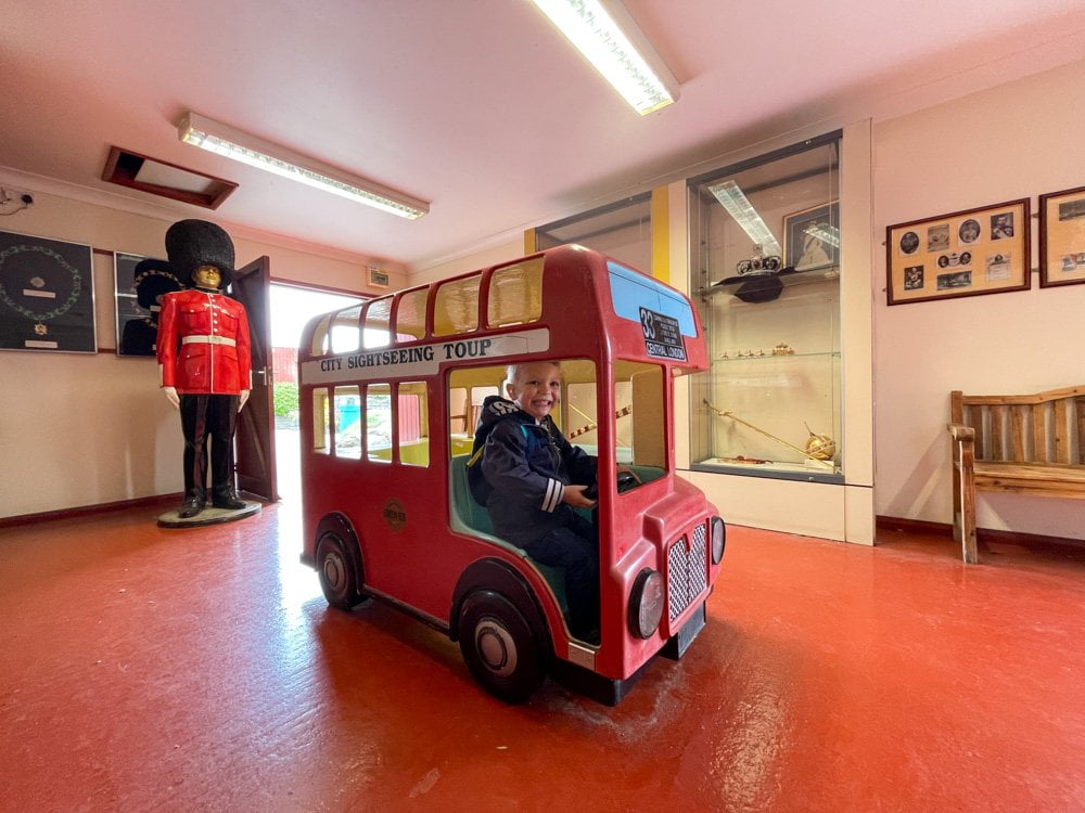 Ben Bertoni driving a London double decker bus in The Crown Jewels display at Merrivale Model Village in Great Yarmouth