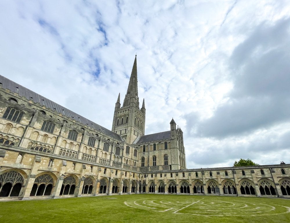 The cloister of Norwich Cathedral with the maze in the lawn