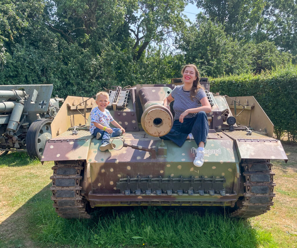 Ben and Paola Bertoni at the Norfolk Tank Museum over a tank