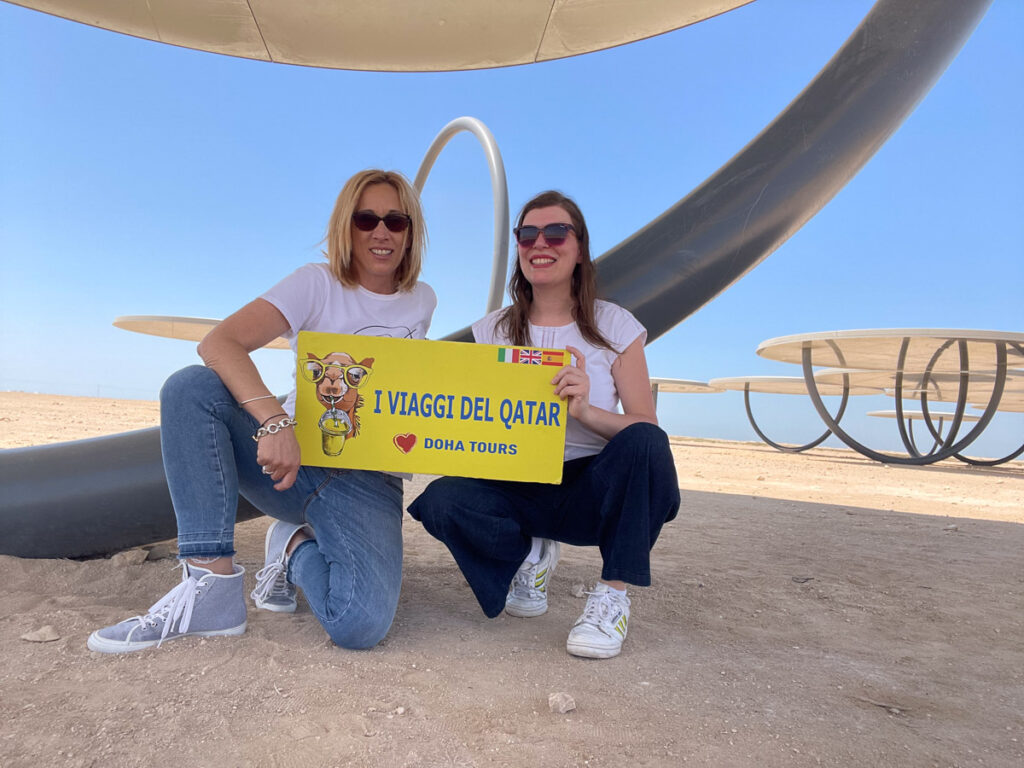 Paola Bertoni and Maria Palma Libotte owner of I Viaggi del Qatar under a mirror of the art installation by Olafur Eliasson in Northern Qatar