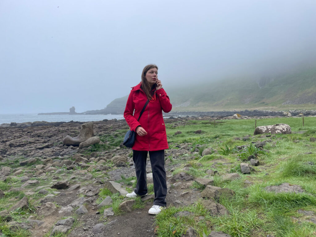 Paola Bertoni listening the audioguide at the Giant's Causeway
