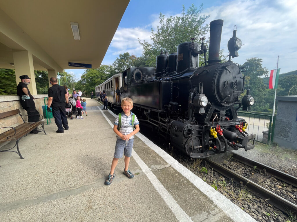 Ben Bertoni in front of a steam engine at Hűvösvölgy station on the Budapest Children's Railway