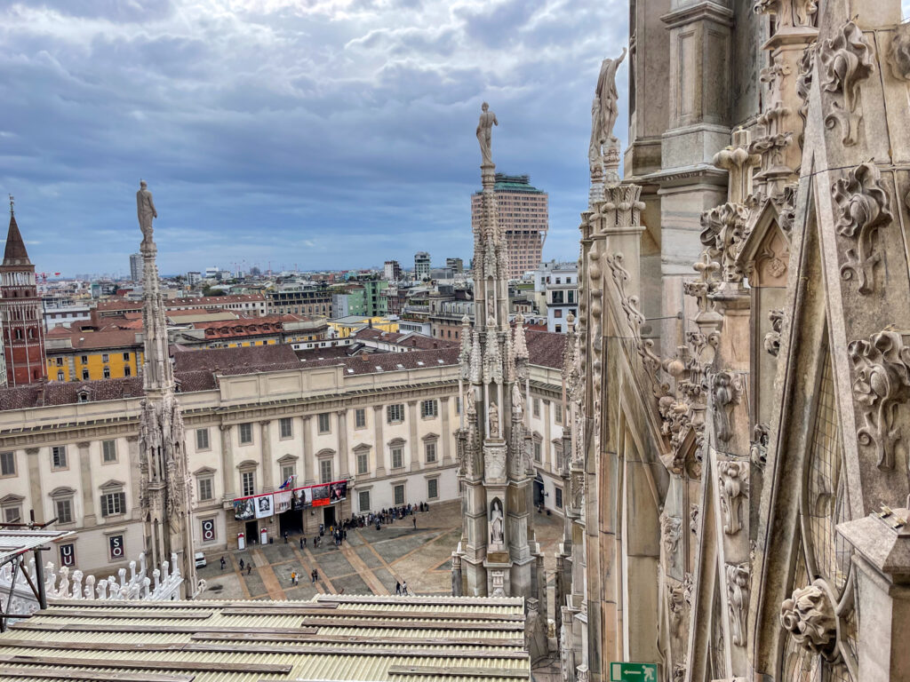 View from the terraces of the Milan Duomo with statues and details of the decorations