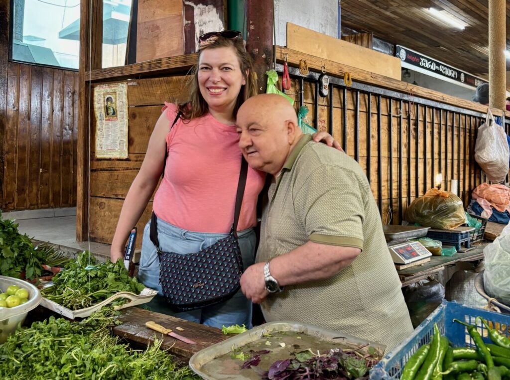 Paola Bertoni with a vendor at the central market in Kutaisi, Georgia