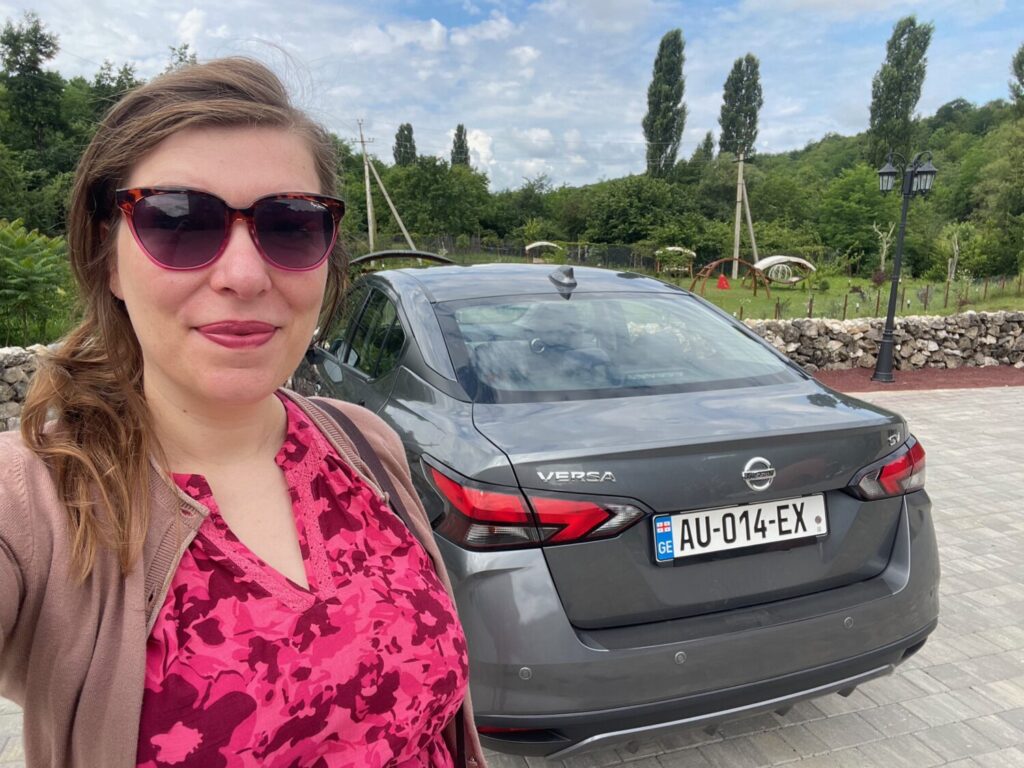Paola Bertoni with the Nissan Versa she rented for her trip in Georgia