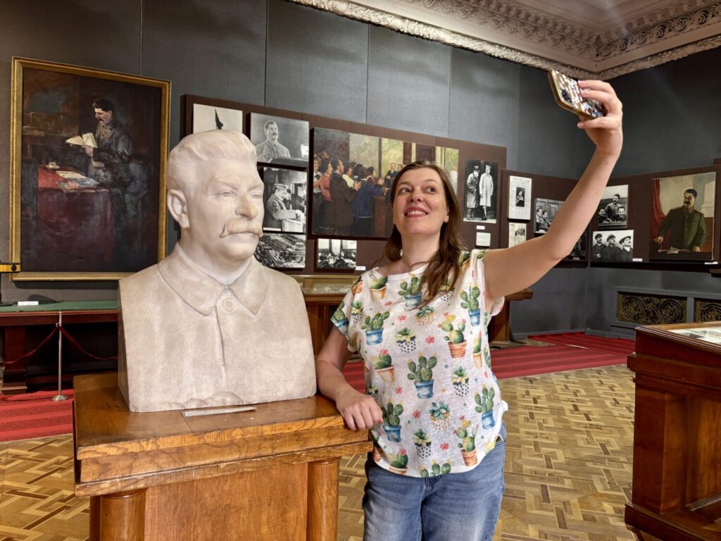 Paola Bertoni takes a selfie with the Stalin statue at the Stalin Museum in Gori, Georgia
