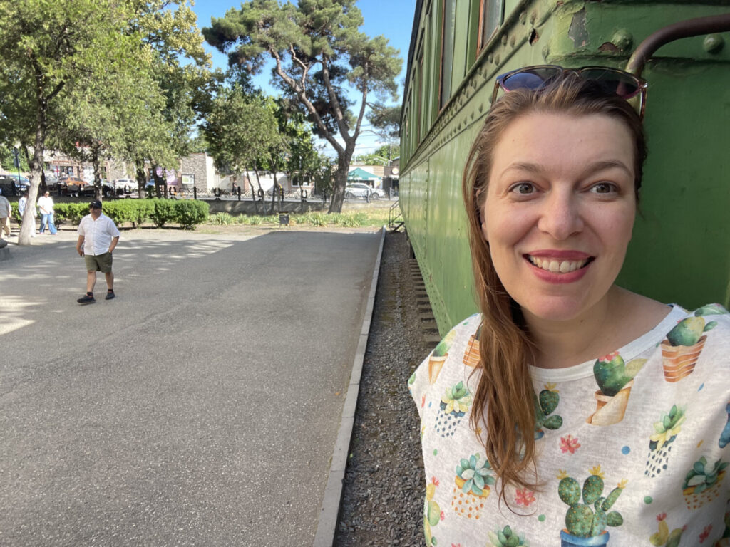 Paola Bertoni in front of Stalin's private carriage, at the Stalin Museum in Gori