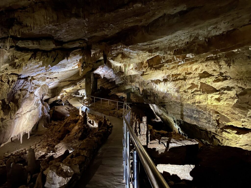 A section of the Prometheus Cave trail, with stunning rock formations and illuminated pathways