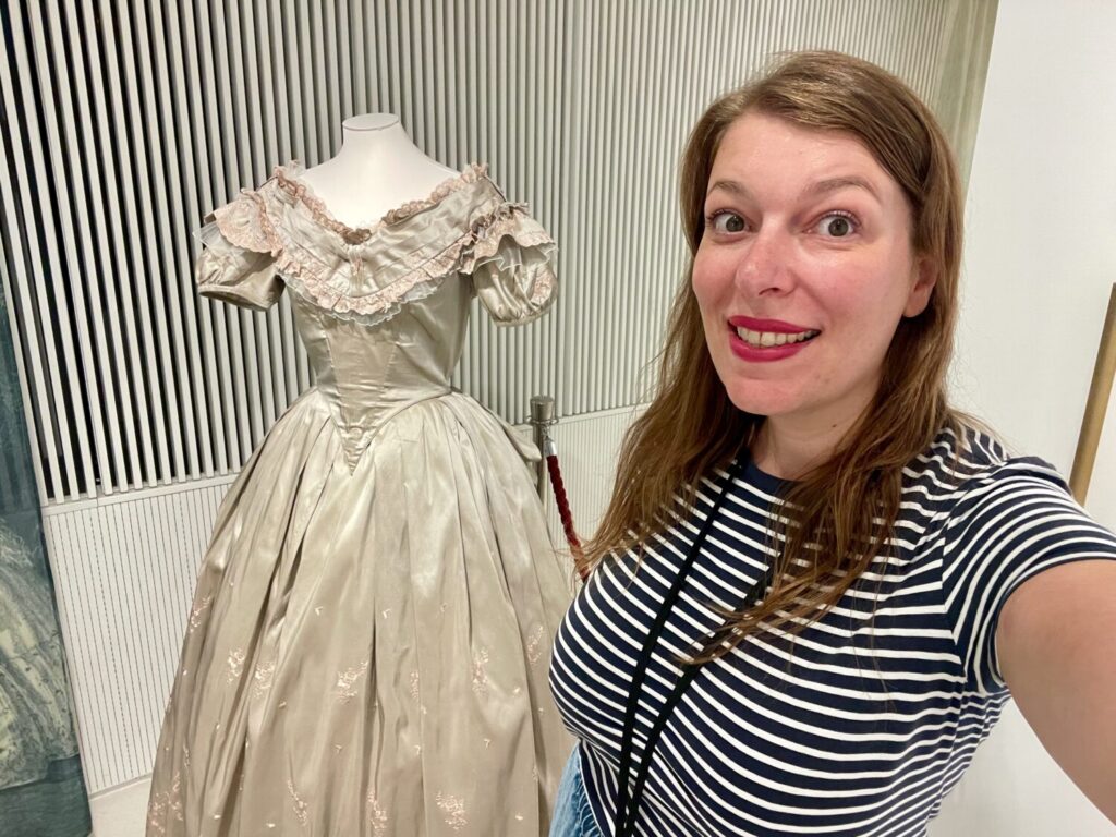Paola Bertoni near a dress used for the Anna-bál in Tihany