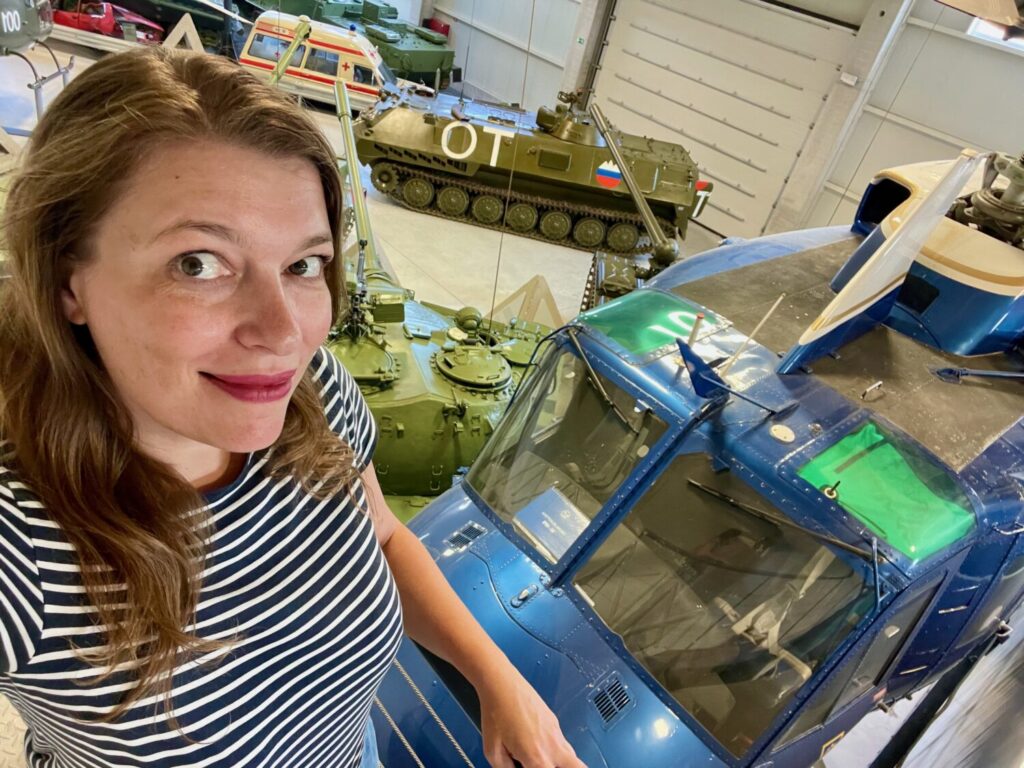 Paola Bertoni in front of a police helicopter at the Museum of Military History in Pivka, Slovenia