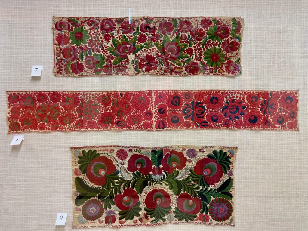 Antique floral embroidery pieces showing traditional Matyó craftsmanship at the Matyó Museum in Mezőkövesd