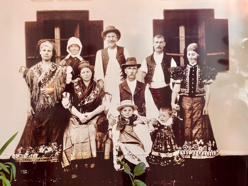 A Matyó family in traditional embroidered folk costumes from Mezőkövesd at the Matyó Museum