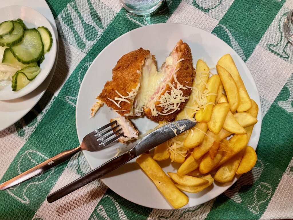 Cordon bleu with chips and pickles at Templomkert Étterem in Szeged