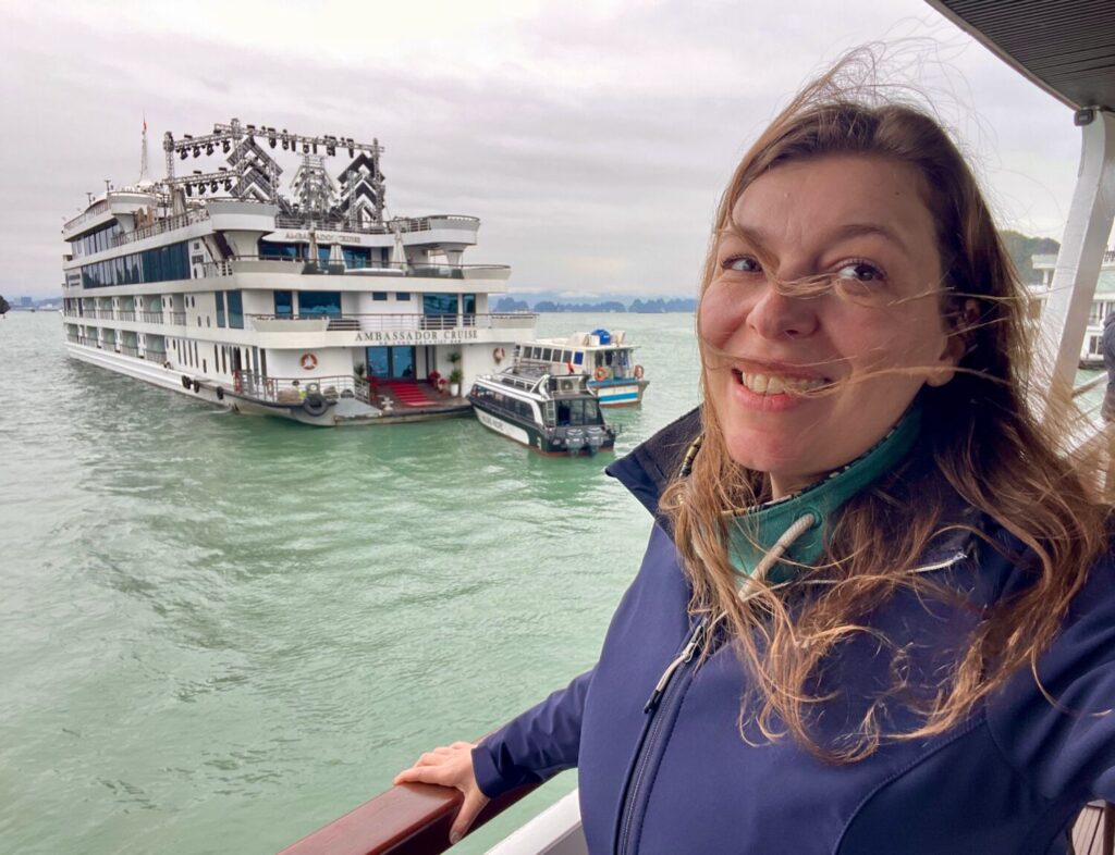 Paola Bertoni in front of the Ambassador Cruise II cruise ship in Ha Long Bay, Vietnam