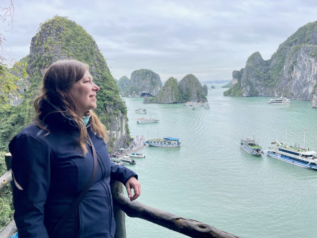 Paola Bertoni at a scenic viewpoint overlooking Ha Long Bay, Vietnam