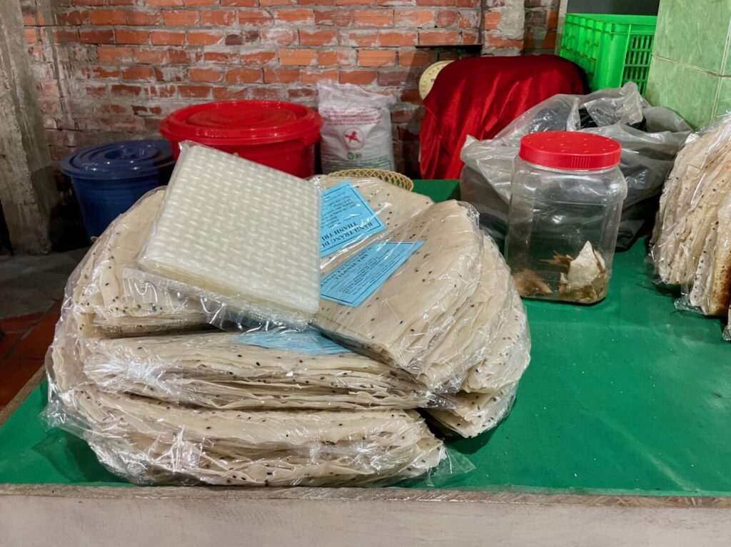 Sheets of coconut crackers and rice paper for sale in Cai Be, Vietnam