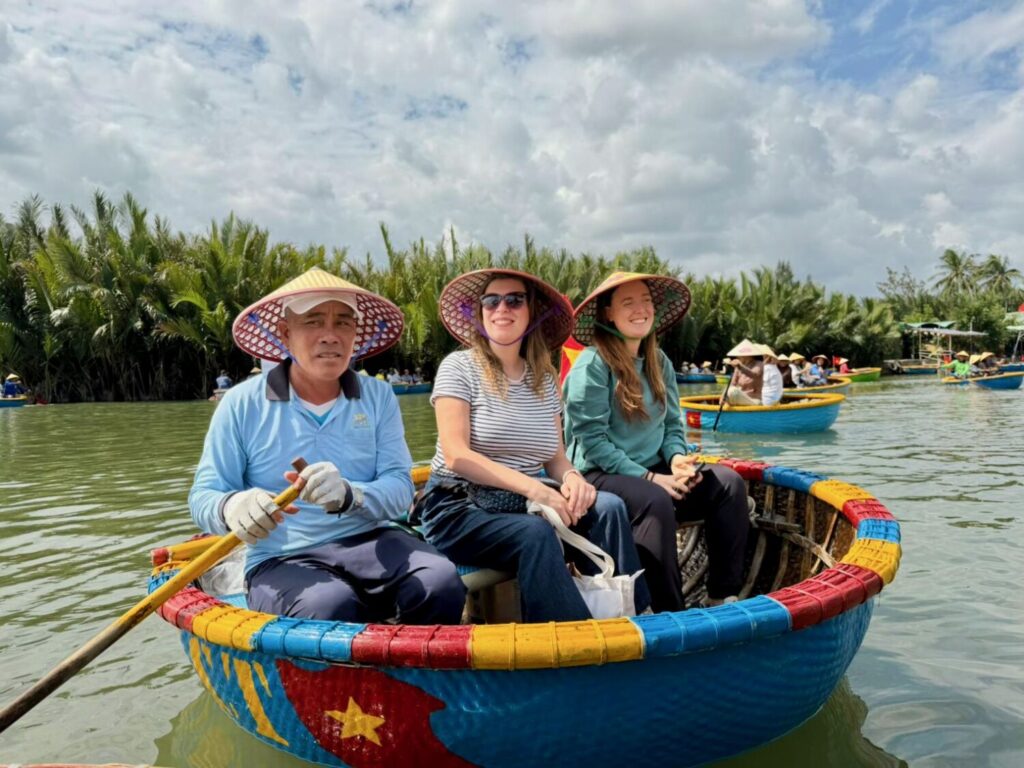 Paola Bertoni and Veronica Meriggi on board a bamboo boat in the Thu Bon River delta, Vietnam