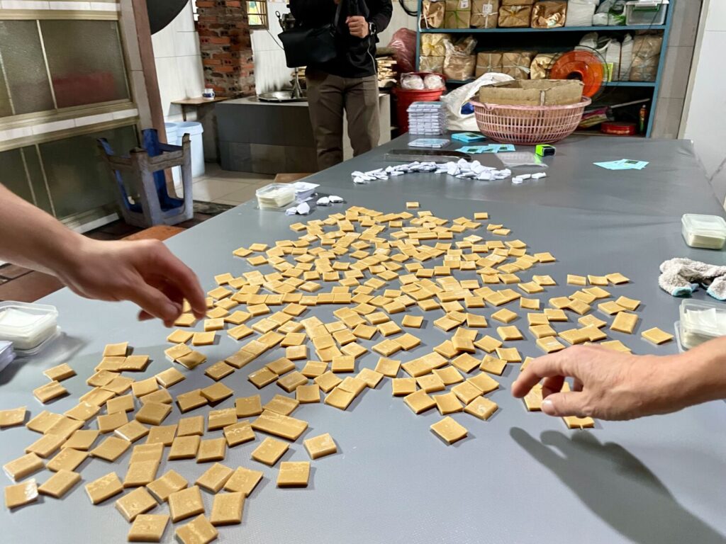 Traditional coconut candy making in Cai Be