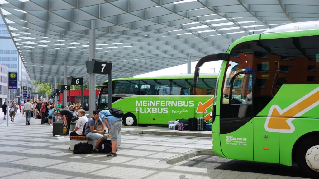 Passengers waiting at the ZOB (central bus station) in Hannover, Germany