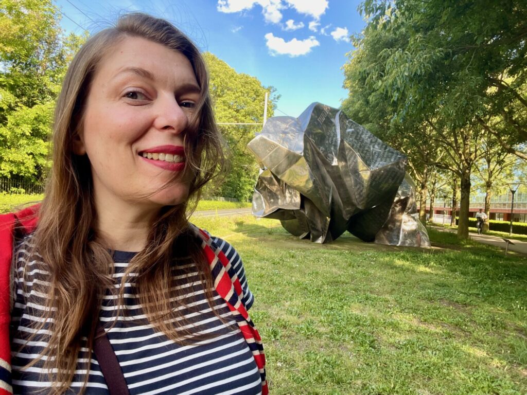 Paola Bertoni in front of Wang Du’s World Markets sculpture at the Lyon Museum of Contemporary Art