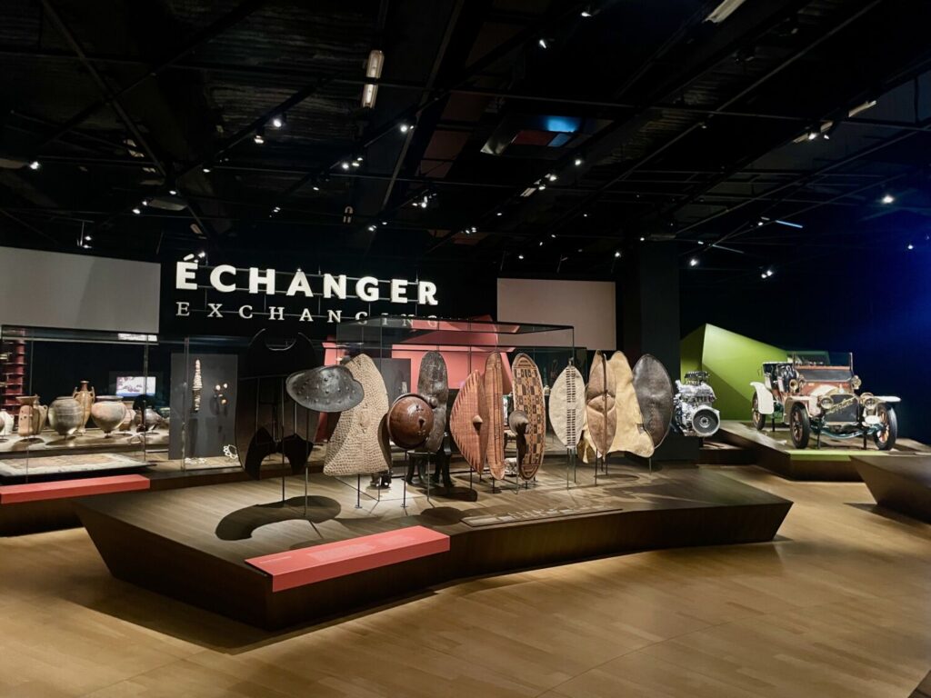 Anthropological artefacts and shields displayed inside the Musée des Confluences, Lyon