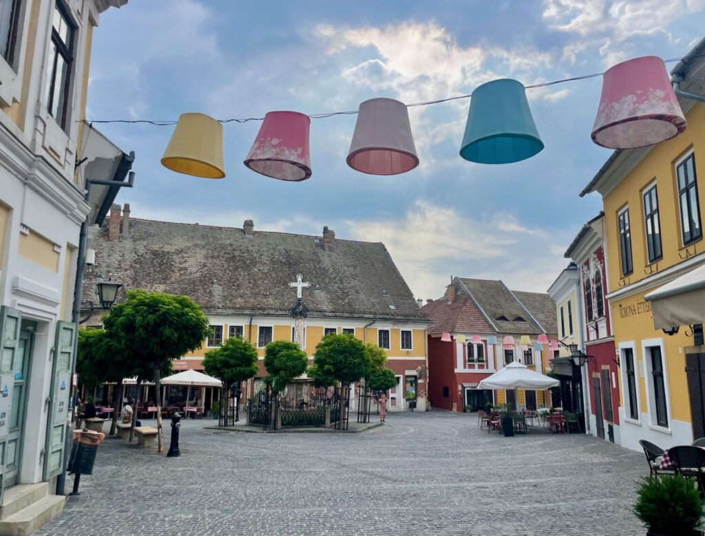 Colourful hanging lamps above the peaceful main square of Szentendre