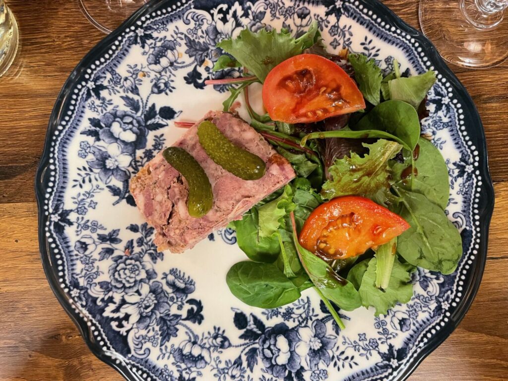Traditional Lyonnaise meat terrine served with cornichons
