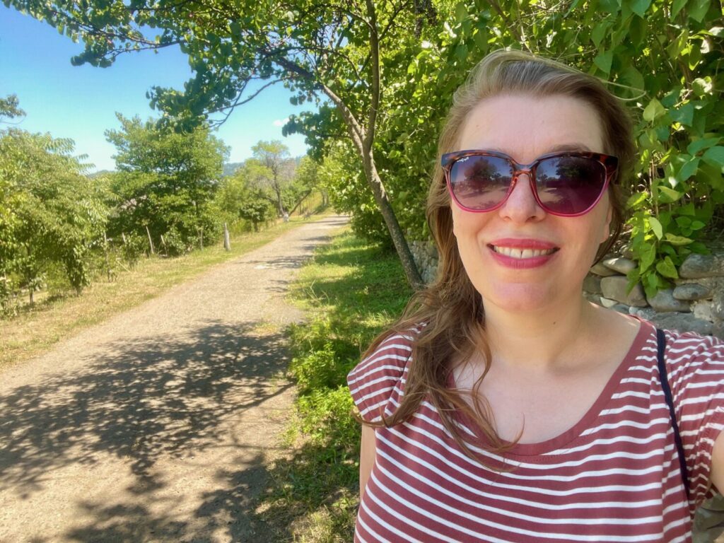 Paola Bertoni on a path between houses at the Giorgi Chitaia Open Air Ethnographic Museum in Tbilisi