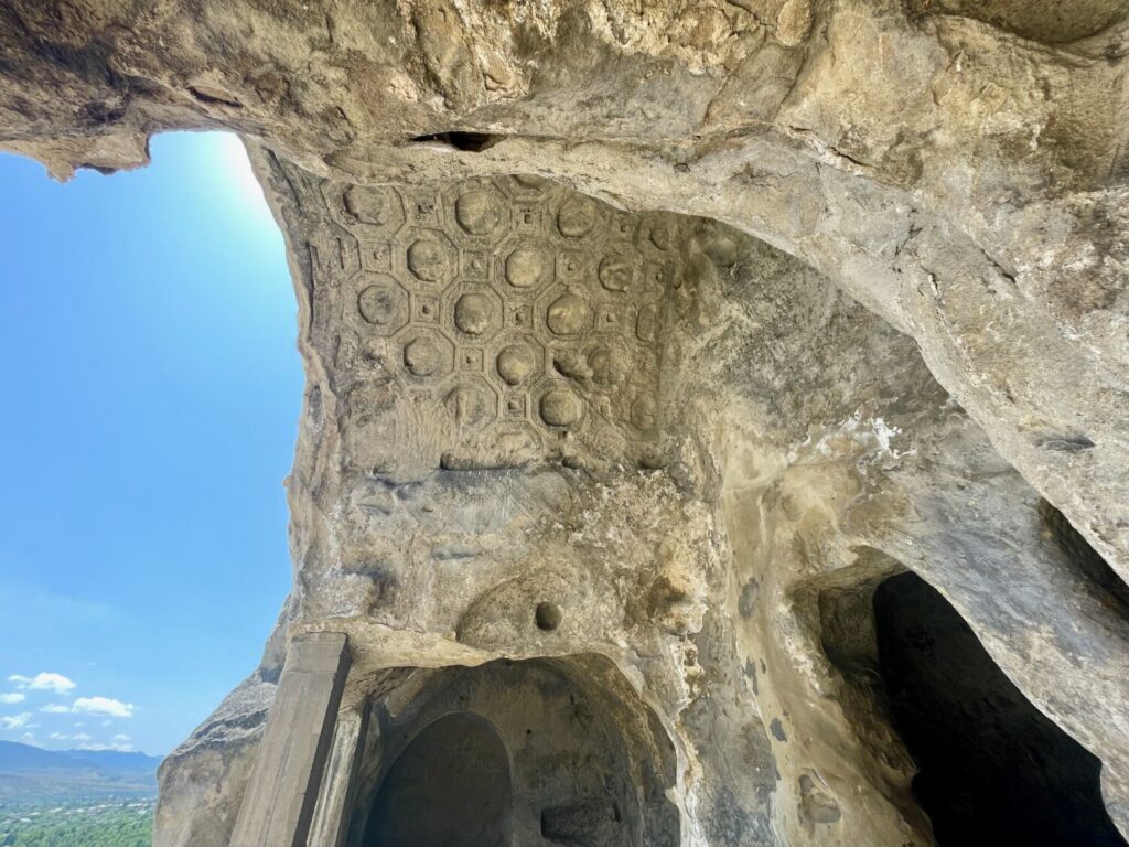 Ceiling of a rock-cut room with coffered stone decoration