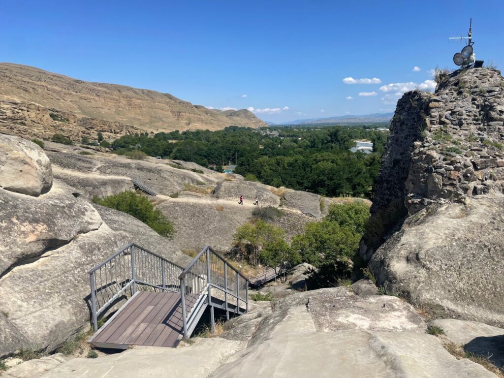The scenic path at Uplistsikhe, with metal walkways overlooking the Mtkvari river valley