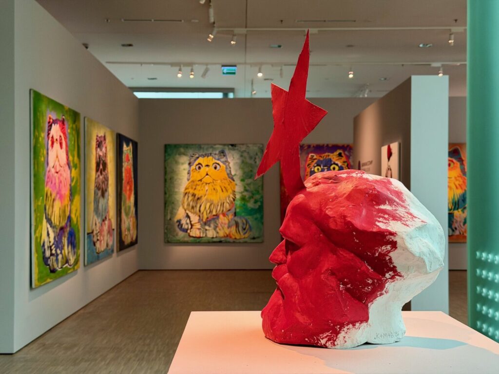 Sculpture of Marx alongside cat paintings at the Silesian Museum in Katowice, Poland