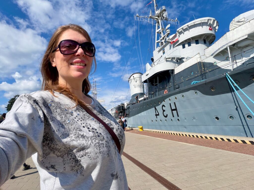 Paola Bertoni in front of the ORP Błyskawica Museum Ship in Gdynia, Poland